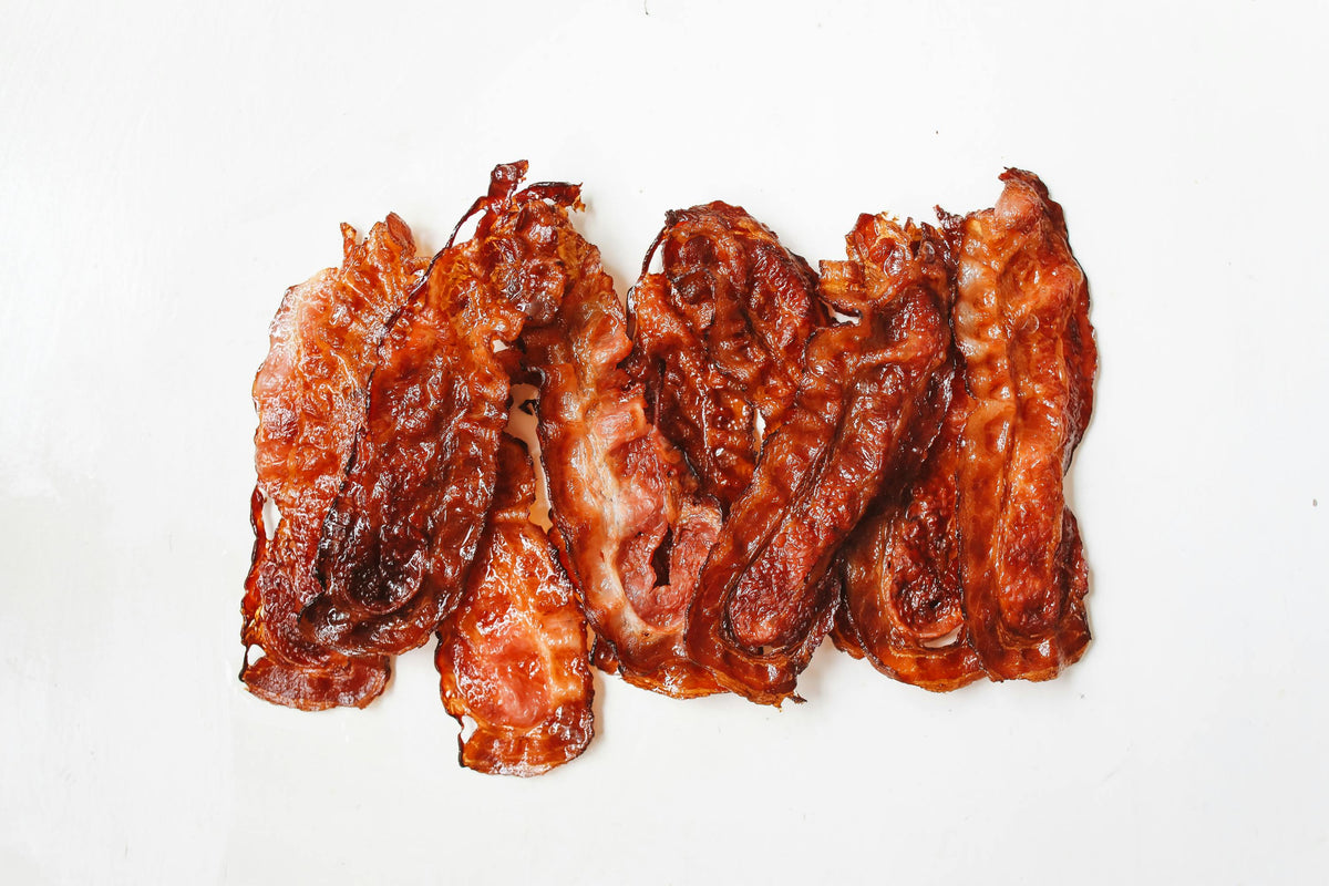 Pawvanti soft and chewy bacon and cheese dog treats on a white background, showing the tasty, savory treats for dogs.